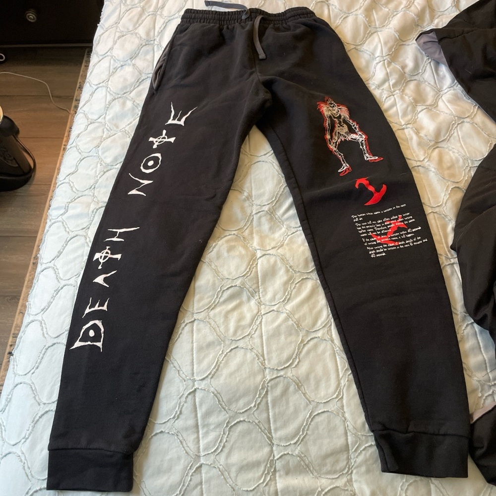 Black Graphic Sweatpants with Red and White Designs
